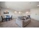 Bright, open game room featuring a sofa, game table, and a small dining area at 13103 Wildflower Meadow Dr, Riverview, FL 33579