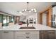 Close up on kitchen island with stainless steel dishwasher and sink with open concept living at 13103 Wildflower Meadow Dr, Riverview, FL 33579