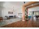 Open-concept living room features modern chandelier and a view of the light filled kitchen at 13103 Wildflower Meadow Dr, Riverview, FL 33579