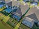 Aerial view of backyard pools and outdoor spaces, including the water view at 14522 Woodland Spur Dr, Lithia, FL 33547