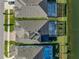 Aerial view of backyard pools and outdoor spaces, including the water view at 14522 Woodland Spur Dr, Lithia, FL 33547
