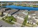Aerial view of the house, a lake, and the community showcasing the beautiful surroundings at 14522 Woodland Spur Dr, Lithia, FL 33547