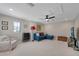 Bonus room with comfortable seating, neutral walls, and plush carpeting throughout at 14522 Woodland Spur Dr, Lithia, FL 33547