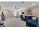 Spacious bonus room with natural light, plush carpet, and comfortable seating at 14522 Woodland Spur Dr, Lithia, FL 33547