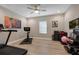 Spacious exercise room with various equipment for a complete workout at 14522 Woodland Spur Dr, Lithia, FL 33547