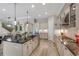 Bright kitchen with a large island, stainless steel appliances, and an efficient layout for cooking and entertaining at 14522 Woodland Spur Dr, Lithia, FL 33547