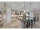 Well-lit open kitchen equipped with a large island, plenty of storage, and a cozy breakfast nook at 14522 Woodland Spur Dr, Lithia, FL 33547