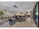 Spacious living area featuring an open floor plan, stylish furnishings, and great flow to the kitchen and backyard at 14522 Woodland Spur Dr, Lithia, FL 33547