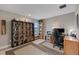 Office space filled with shelves, books, and a wooden desk near a natural light window at 14522 Woodland Spur Dr, Lithia, FL 33547