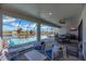 Screened outdoor living area with furniture, a fan, and a beautiful view of the pool at 14522 Woodland Spur Dr, Lithia, FL 33547