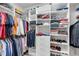 Organized walk-in closet with ample shelving and hanging space for clothing and accessories at 14522 Woodland Spur Dr, Lithia, FL 33547