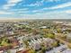 Stunning aerial view of a residential community, showcasing its lush greenery and neighborhood layout at 1467 Twin Villas Way, Dunedin, FL 34698