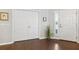 Inviting entryway with wood floors, closet, and natural light, offering a warm welcome at 1467 Twin Villas Way, Dunedin, FL 34698