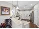 Clean kitchen with white cabinets, granite countertops, and stainless steel appliances at 1467 Twin Villas Way, Dunedin, FL 34698