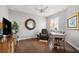 Well-lit office space with wood floors, modern furniture, and plantation shutters at 1467 Twin Villas Way, Dunedin, FL 34698