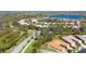 Neighborhood aerial showcasing the beautiful landscaping, green spaces, and serene lake views at 16232 Amethyst Key Dr, Wimauma, FL 33598