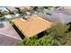 Single-story home boasts a well-kept yard, screened in lanai, and a vibrant tile roof at 16232 Amethyst Key Dr, Wimauma, FL 33598