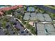Aerial view of the community's tennis courts and parking, enhancing the community's appeal at 16232 Amethyst Key Dr, Wimauma, FL 33598