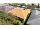 Aerial view of a home featuring a well-maintained tile roof and lush green landscaping at 16232 Amethyst Key Dr, Wimauma, FL 33598
