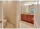 Well-appointed bathroom with dual sinks, granite countertops, and a glass-enclosed shower at 16232 Amethyst Key Dr, Wimauma, FL 33598