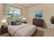 Comfortable bedroom with a large window, neutral tones, and modern furnishings at 16232 Amethyst Key Dr, Wimauma, FL 33598