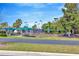 Bocce ball court featuring shaded seating areas and meticulous landscaping at 16232 Amethyst Key Dr, Wimauma, FL 33598