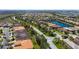 Aerial community shot highlighting the scenic water views, landscaping, and single-Gathering homes at 16232 Amethyst Key Dr, Wimauma, FL 33598