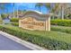 Inviting entrance to Club Valencia Grande with manicured landscaping and clear signage at 16232 Amethyst Key Dr, Wimauma, FL 33598