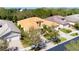 Desirable home showcasing a tile roof, spacious driveway, and meticulously landscaped front yard at 16232 Amethyst Key Dr, Wimauma, FL 33598