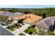 Beautiful single-story home features a tile roof, manicured landscaping, and a brick driveway at 16232 Amethyst Key Dr, Wimauma, FL 33598