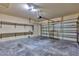 Spacious garage with ample room for parking and storage featuring convenient shelving at 16232 Amethyst Key Dr, Wimauma, FL 33598
