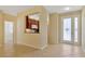 Open living space showcasing tile flooring and partial view of kitchen at 16232 Amethyst Key Dr, Wimauma, FL 33598