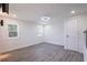 Bedroom featuring light gray wood floors, two windows, and recessed lights at 163 Dolphin E Dr, Oldsmar, FL 34677