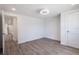 Clean bedroom with recessed lighting, gray wood floors, and closet space at 163 Dolphin E Dr, Oldsmar, FL 34677