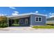 Charming single-story home with covered parking and neat landscaping at 163 Dolphin E Dr, Oldsmar, FL 34677
