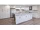 Modern kitchen featuring a large center island, stainless steel appliances and lots of cabinet space at 163 Dolphin E Dr, Oldsmar, FL 34677