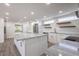 Elegant kitchen with a center island, stainless steel appliances, and plenty of cabinet space at 163 Dolphin E Dr, Oldsmar, FL 34677