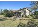 View of the backyard featuring screened lanai at 18739 Bascomb Ln, Hudson, FL 34667
