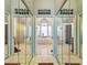 Luxurious bathroom with mirrored walls, a soaking tub, and a separate shower at 18739 Bascomb Ln, Hudson, FL 34667