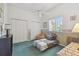 Bedroom showcasing a ceiling fan and a window, along with a double closet at 18739 Bascomb Ln, Hudson, FL 34667