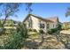 Exterior view of the house showcases well-maintained landscaping and architectural details at 18739 Bascomb Ln, Hudson, FL 34667