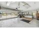 Spacious garage with a view of the brick driveway and street, offering ample space for vehicles and storage at 18739 Bascomb Ln, Hudson, FL 34667