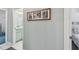 Hallway view of artwork leading to the guest bathroom and bedroom at 18739 Bascomb Ln, Hudson, FL 34667