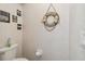 Charming powder room with nautical themed decor and fixtures at 18739 Bascomb Ln, Hudson, FL 34667