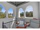 Second-story balcony with seating and a view of trees and sky at 2227 29Th S St, St Petersburg, FL 33712