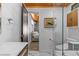 Bathroom with walk-in shower and view into the bedroom at 2227 29Th S St, St Petersburg, FL 33712