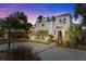 Stunning two-story home featuring a red tile roof, white stucco exterior, and beautiful landscaping at 2227 29Th S St, St Petersburg, FL 33712