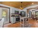 Kitchen features stainless steel appliances, terracotta tile floors, and wooden island at 2227 29Th S St, St Petersburg, FL 33712