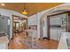 Open kitchen flows to dining area, features terracotta tile floors and stainless steel appliances at 2227 29Th S St, St Petersburg, FL 33712