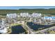 High-angle view showcasing resort buildings with landscaping, ponds, and parking areas at 2333 Feather Sound Dr # A308, Clearwater, FL 33762